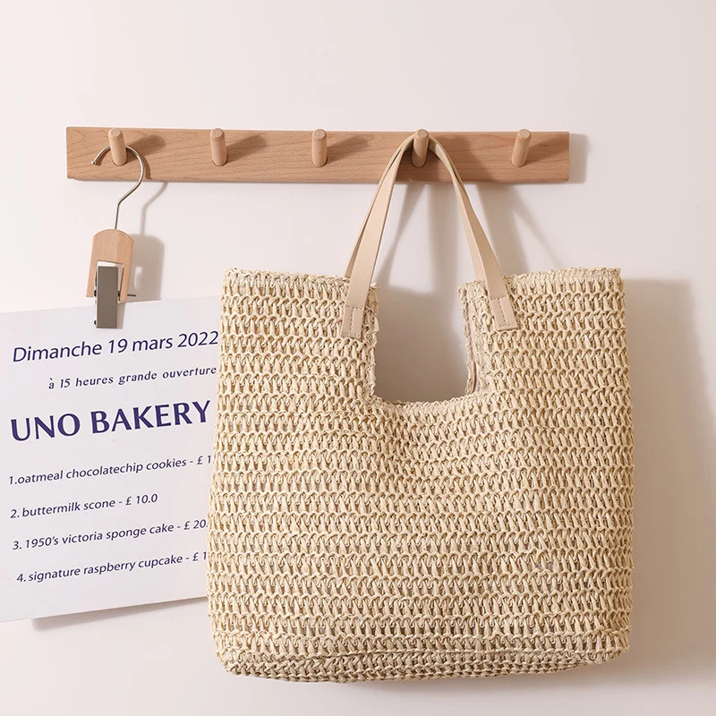 Elegante geflochtene Tragetasche mit robusten Ledergriffen Skanto