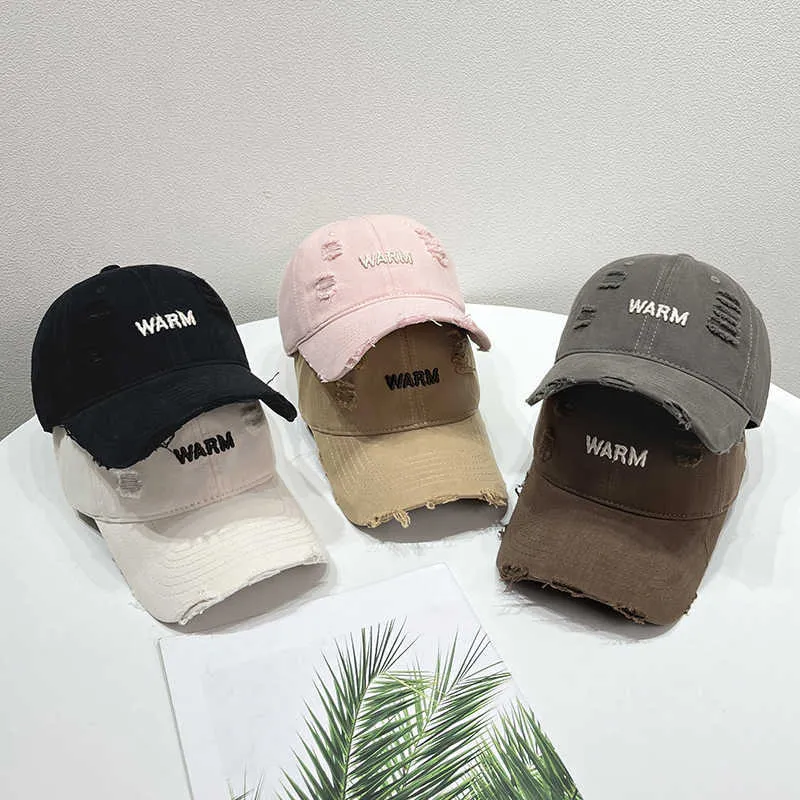 Damen Baumwoll-Cap im Used-Look mit gestickter Botschaft Skanto