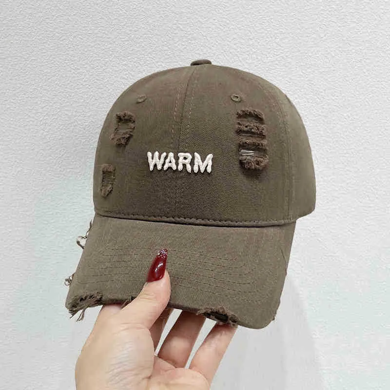 Damen Baumwoll-Cap im Used-Look mit gestickter Botschaft Skanto