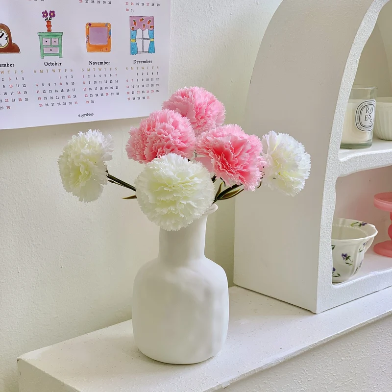 Dekoratives Blumenmittelstück für Tischdekoration
