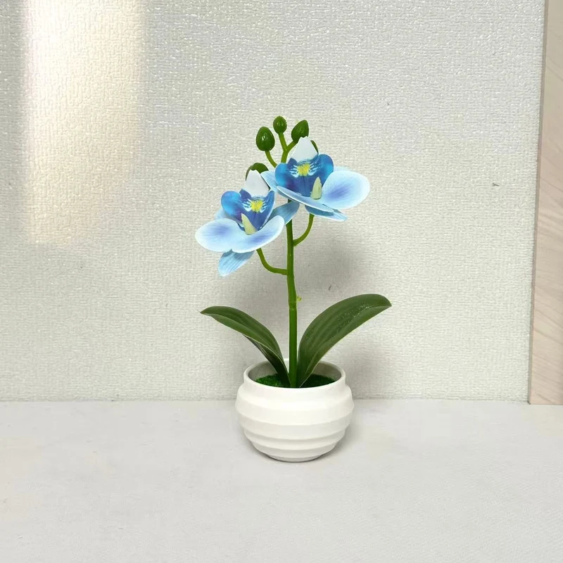 Lebensechte dekorative Orchideenpflanzenarrangement für die Wohnkultur
