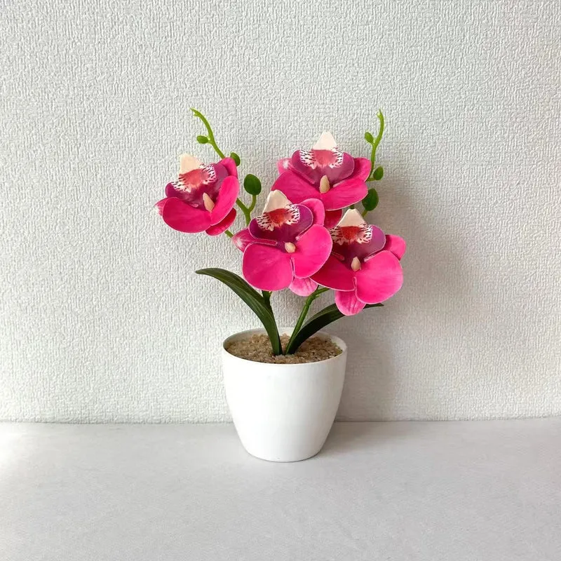 Elegante synthetische Orchideenarrangement