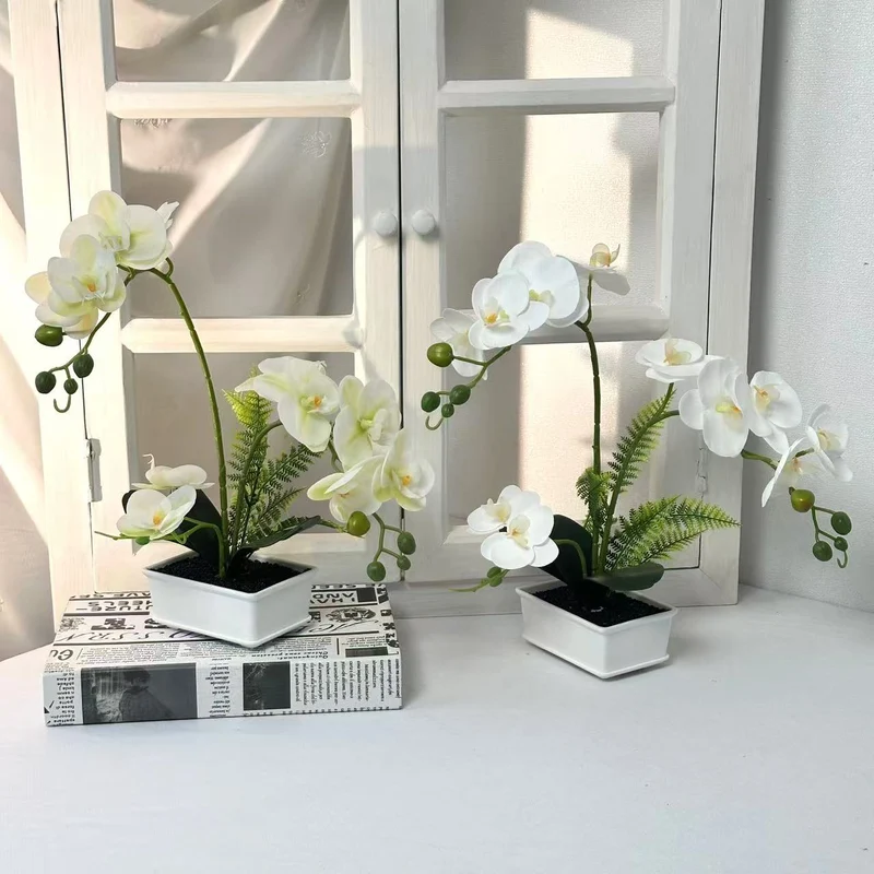Elegante künstliche Orchideenarrangement für die Innendekoration