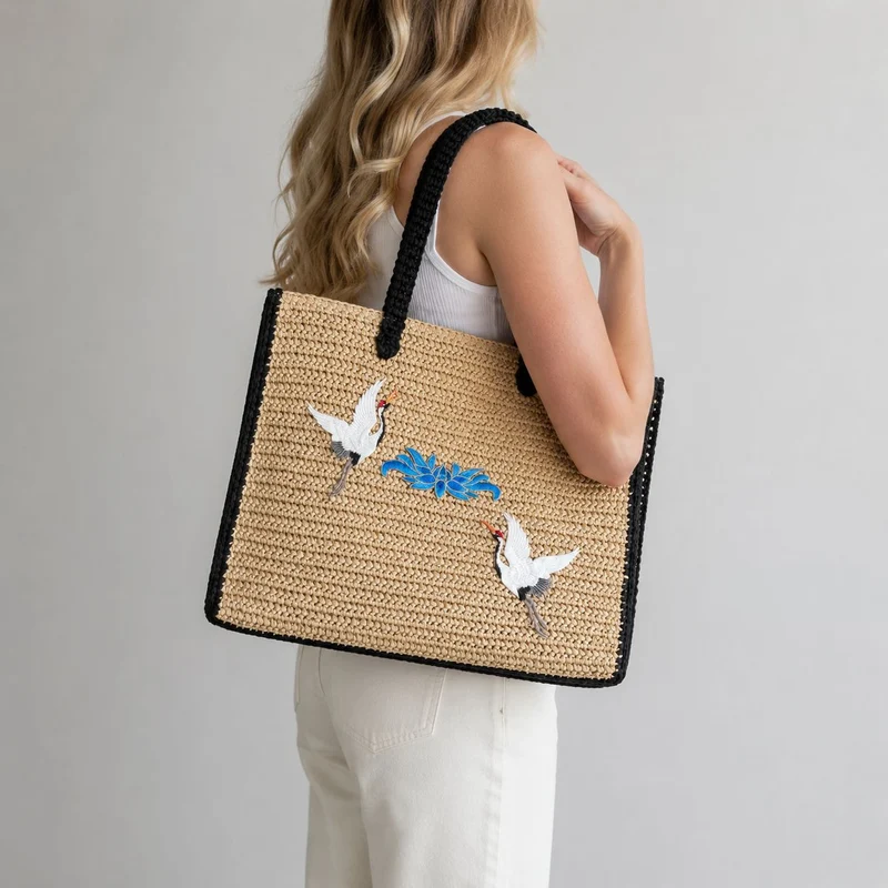 Elegante Stroh-Tote-Bag mit künstlerischem Stickdesign Skanto