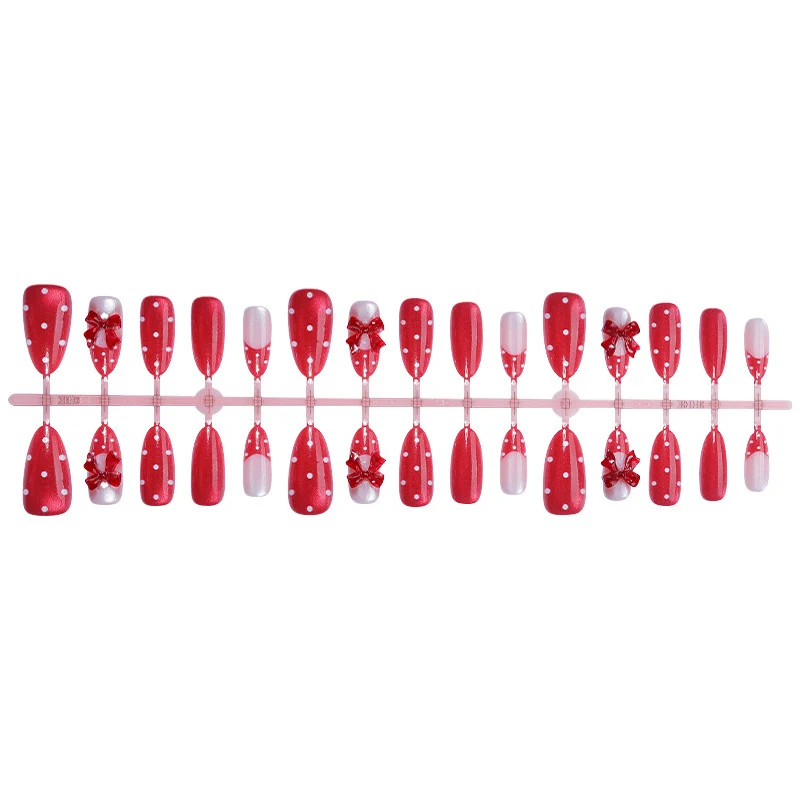 Charmantes dekoratives Press-On Nagelkunstset mit Schleifen- und Punkten-Design Brehn