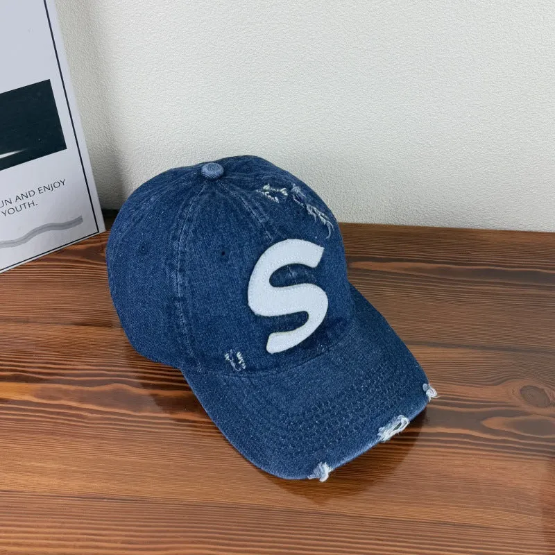Damen Baseballkappe im Used-Look mit Grafik-Logo Skanto
