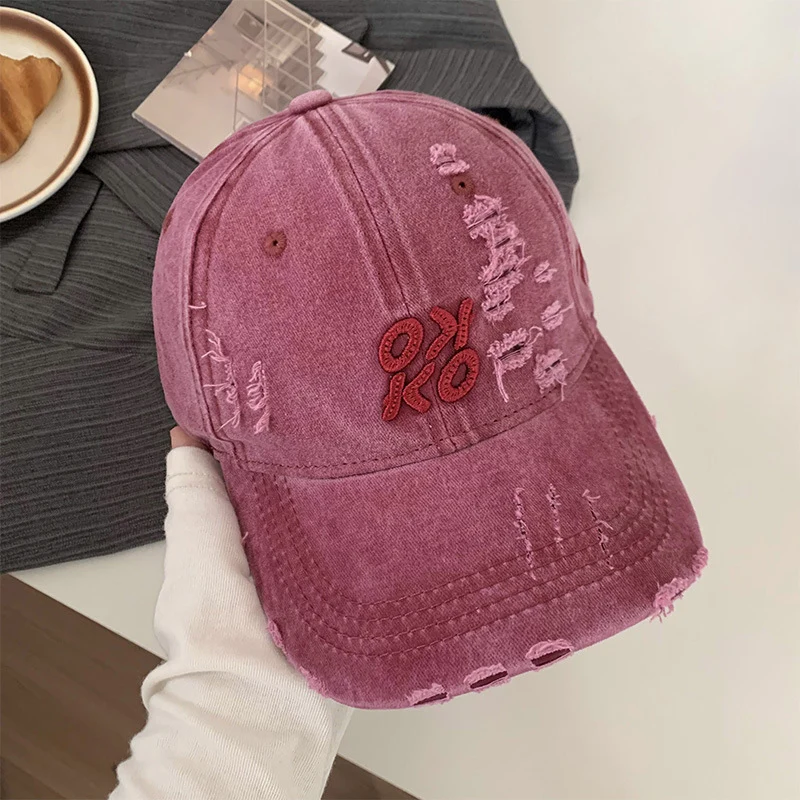 Damen Baseballkappe im Used-Look mit Grafikstickerei Skanto