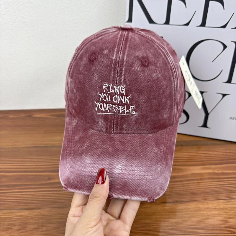 Damen Baseballkappe im Used-Look mit Motiv Skanto