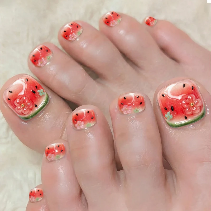 Kunstnagelset mit Wassermelonen-Design und floralen Akzenten Brehn