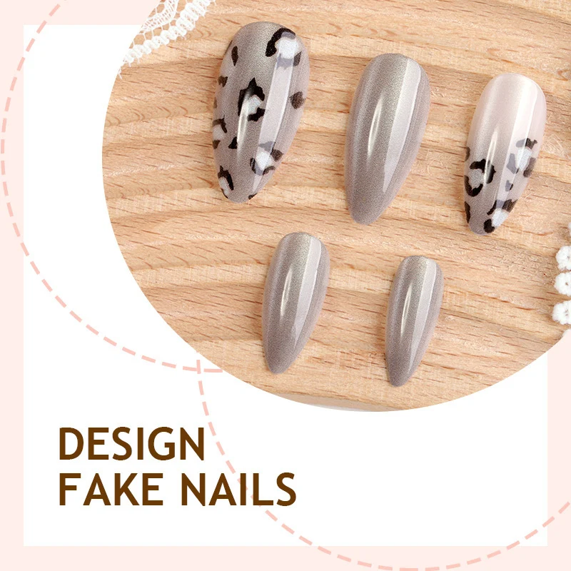 Kunstnagelset mit modischen Leomuster und eleganten Grautönen Brehn