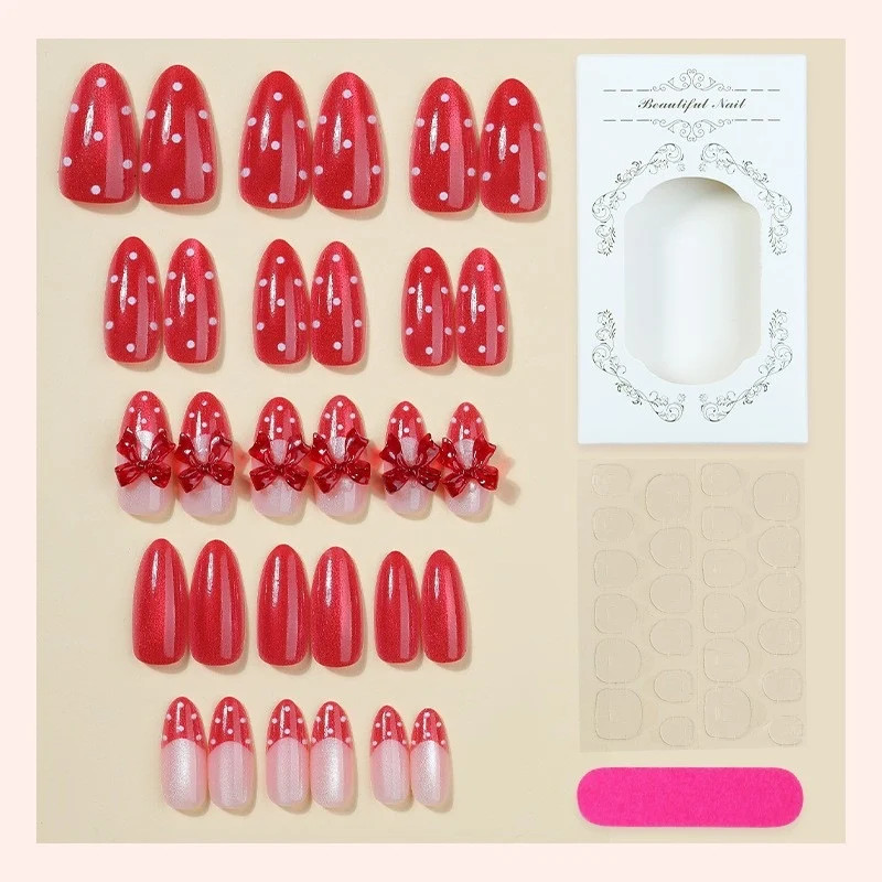 Kunstnagelset mit verspieltem Schleifen-Design und polka Punkte Brehn