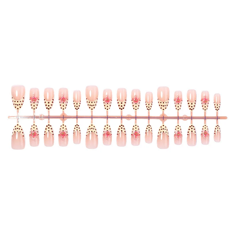 Kunstnagelset mit floralem Design und eleganten Punkten Brehn