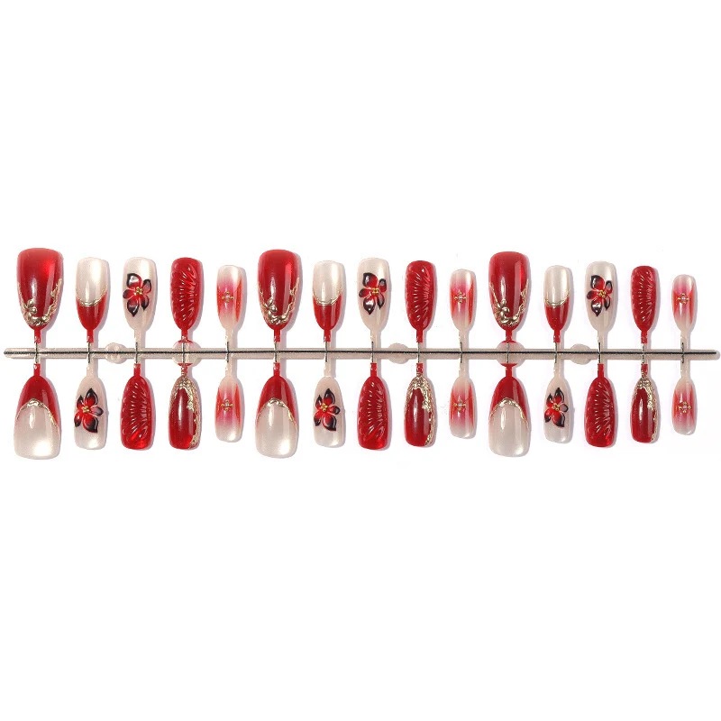 Kunstnagelset mit floralem Design und eleganten Glitzerdetails Brehn