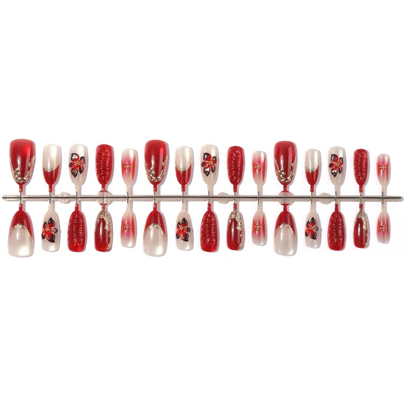 Kunstnagelset mit floralem Design und eleganten Glitzerdetails Brehn