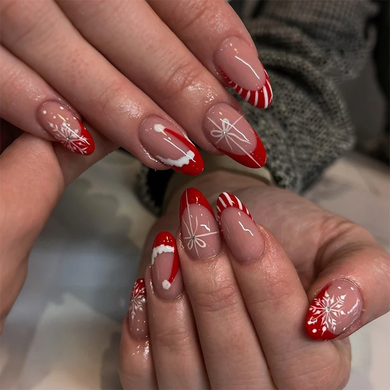Kunstnagelset mit festlichen Wintermotiven und eleganten Akzenten Brehn