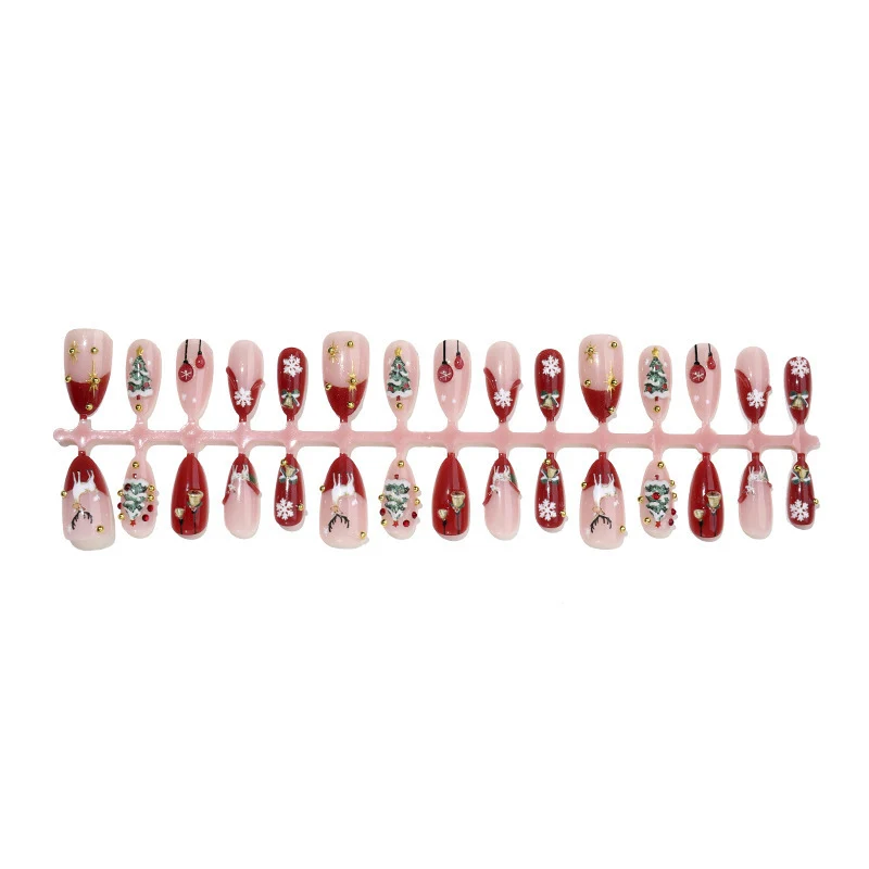 Kunstnagelset mit festlichen Motiven und Glitzerelementen Brehn