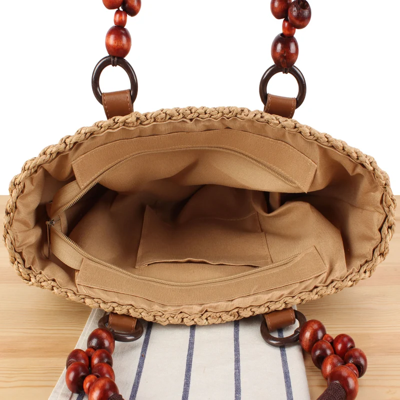 Handtasche mit dekorativen Holzperlen und Naturgeflecht Skanto