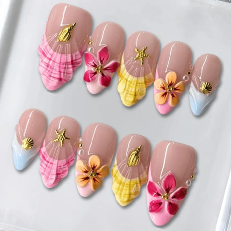 Kunstnagelset mit farbenfrohen Blütenmotiven und Glitzerdetails Brehn