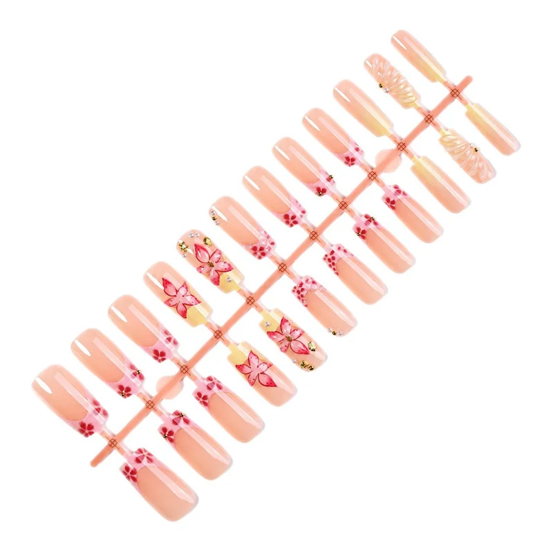 Kunstnagelset mit floralen 3D-Motiven und Glitzerakzenten Brehn