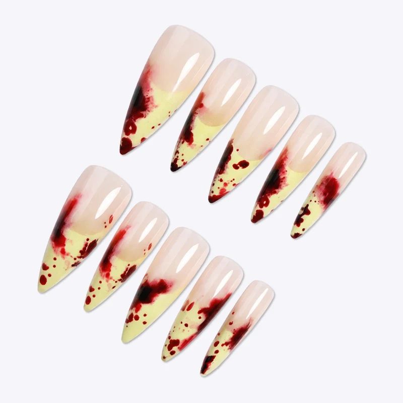 Kunstnagelset mit blutigen Akzenten und elegantem Stiletto-Design Brehn