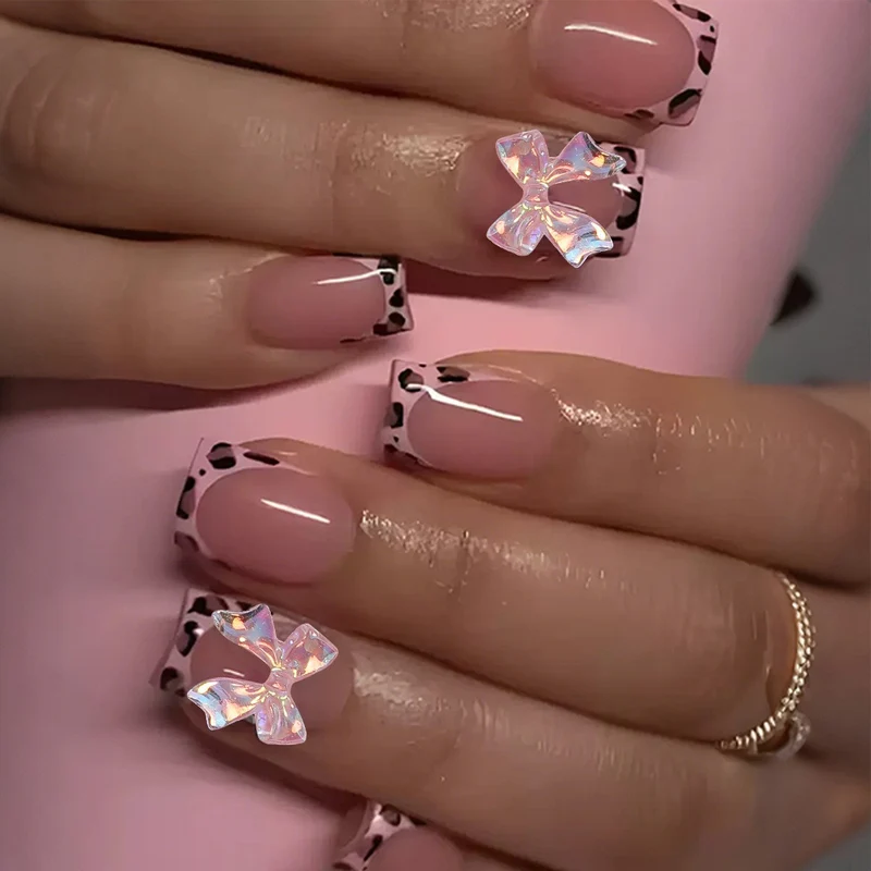 Kunstnagelset mit glamourösem Leopardenmuster und eleganten Schleifen Brehn