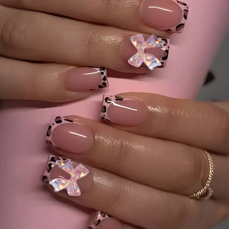 Kunstnagelset mit glamourösem Leopardenmuster und eleganten Schleifen Brehn