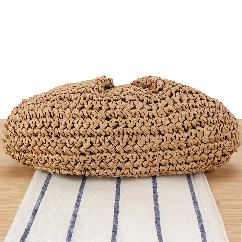 Geflochtene Clutch mit Perlenakzent Skanto