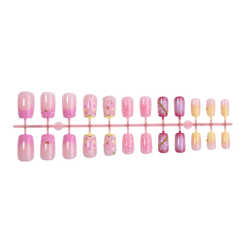 Künstliche Nagelkollektion mit floralem Design und Glitzerakzenten Brehn