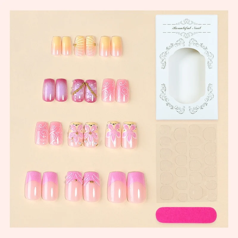 Künstliche Nagelkollektion mit floralem Design und Glitzerakzenten Brehn