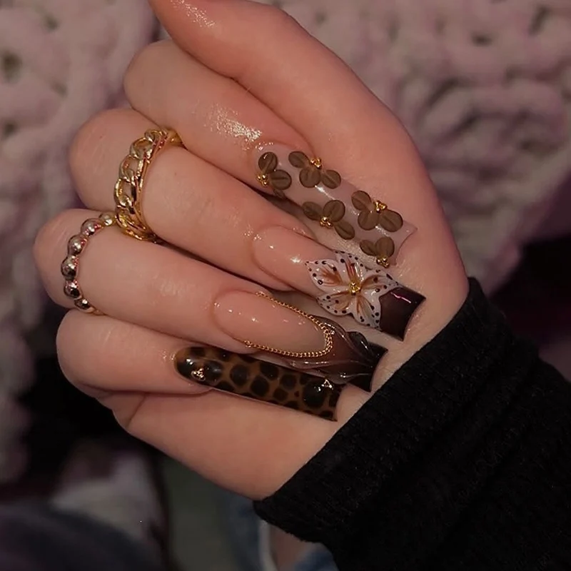 Kreatives Kunstnagelset mit Glamourösen Tiermotiven und Eleganten Verzierungen Brehn