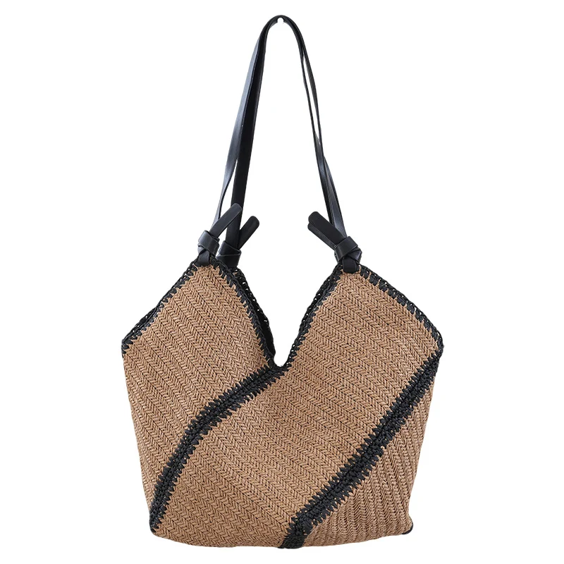 Handtasche aus gewebtem Naturmaterial mit kontrastierenden Ledergriffen Skanto