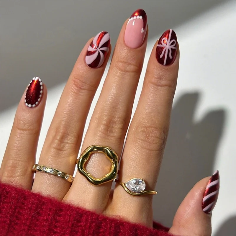 Kreatives Kunstnagelset mit festlichen Karamell- und Streifenmotiven Brehn