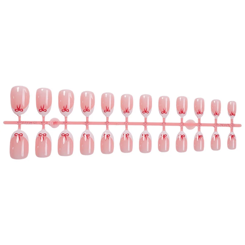 Elegante Kunstnagel-Set mit zarten Schleifenakzenten Brehn