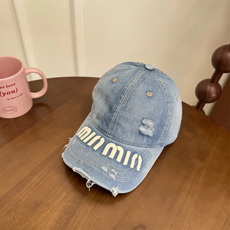 Damen Baseball Cap mit Grafik im Used-Look Skanto