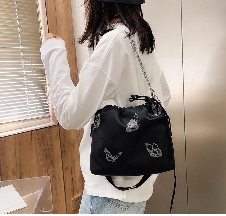 Elegante Drawstring Schmetterlingsdruck Handtasche