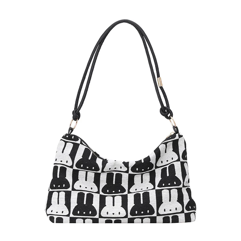 Gepunktete Schultertasche