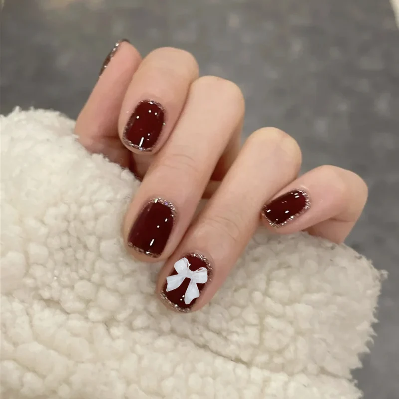 Künstlerisches Press-on-Nagelset mit Schleifen-Design