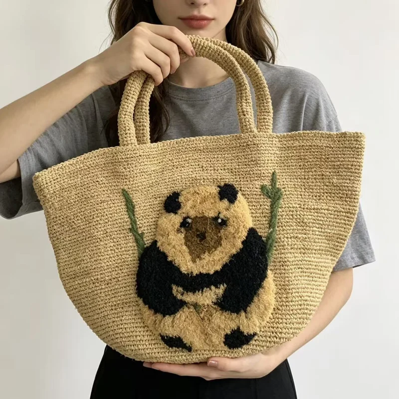 Südsee-inspirierte Korbtasche mit Panda-Motiv Skanto