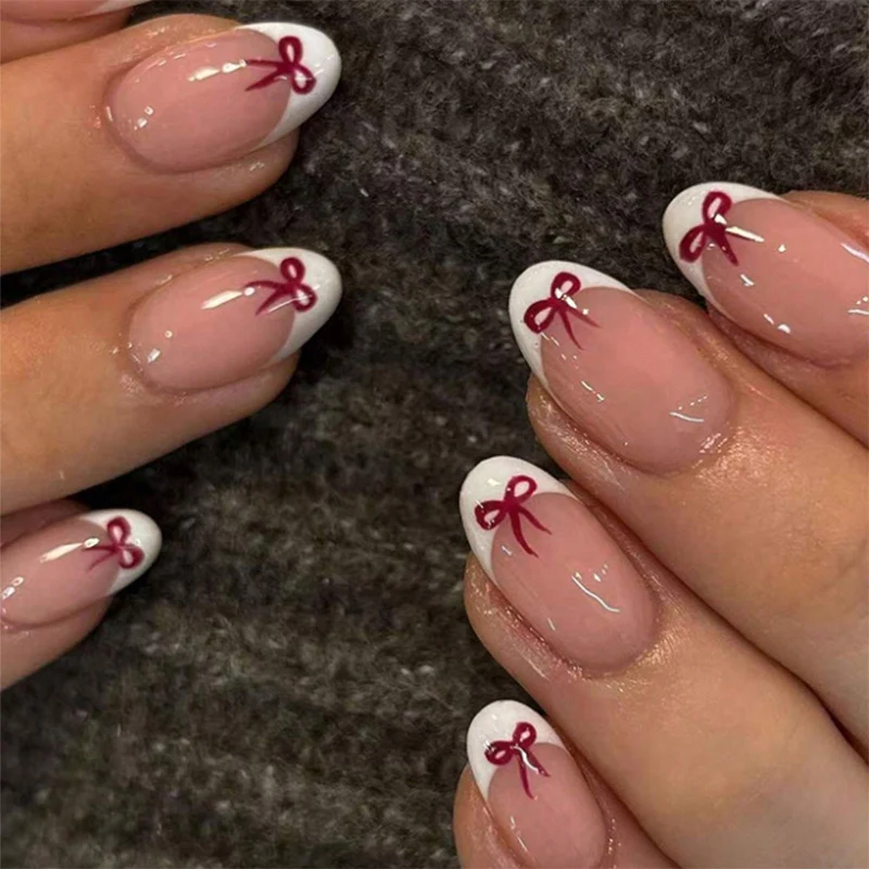 Kunstnagelset mit romantischen Schleifen-Motiven und französischem Design Brehn