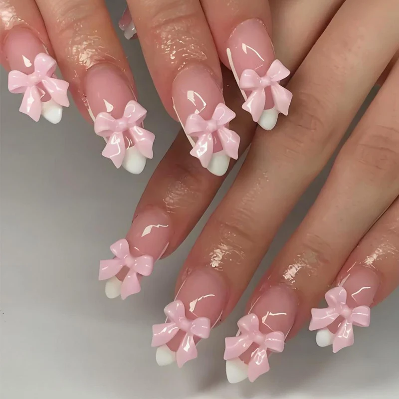 Kunstnagelset mit verspielten Schleifenverzierungen Brehn