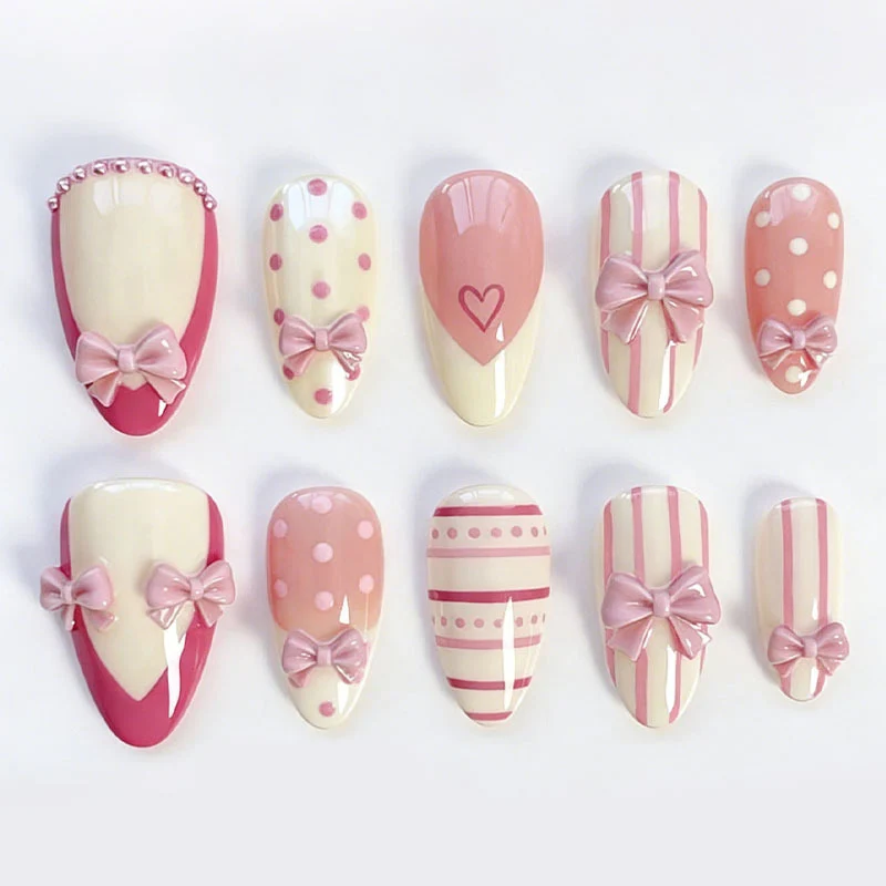 Kunstnagelset mit romantischen Schleifen- und Herzenmotiven Brehn