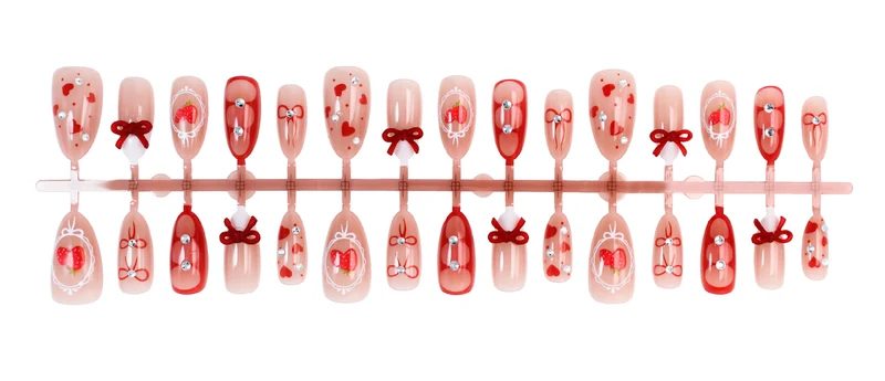 Kunstnagelset mit niedlichen Herz- und Schleifenmotiven Brehn