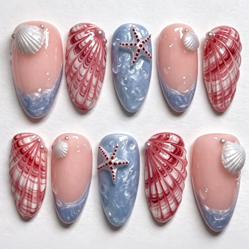 Kunstnagelset mit maritimen Muschel- und Sternenmotiven Brehn