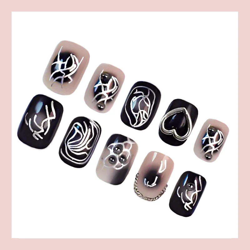 Kunstnagelset mit kreativen Schwarz-Weiß-Mustern Brehn
