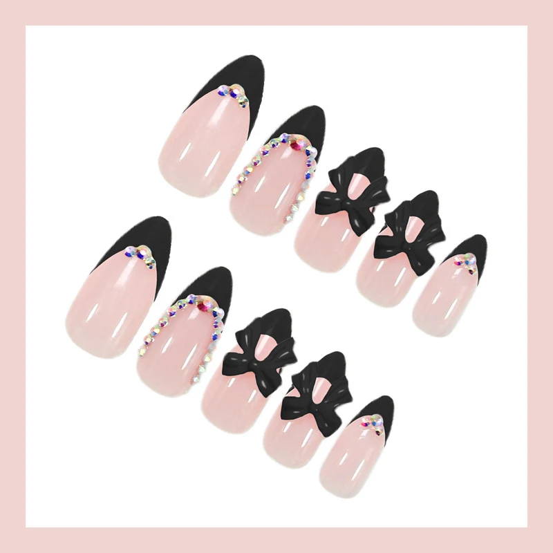 Kunstnagelset mit glamourösem Schleifen-Design und glitzernden Akzenten Brehn