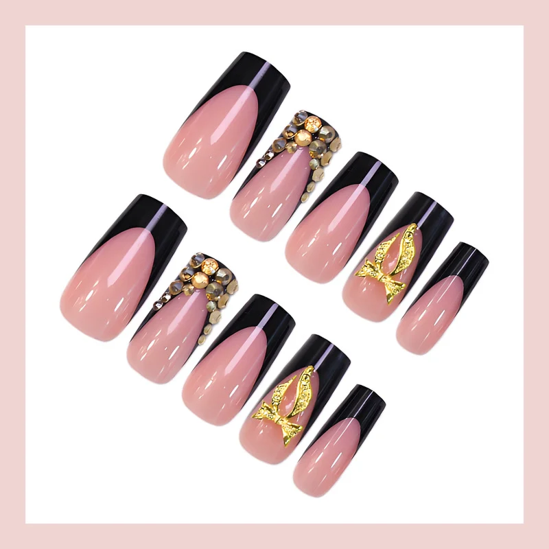 Kunstnagelset mit eleganter Goldverzierung und stilvollem Schwarz Brehn