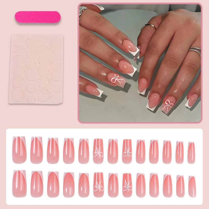 Kunstnagelset mit eleganten Spitzen und zarten Schleifenmotiven Brehn