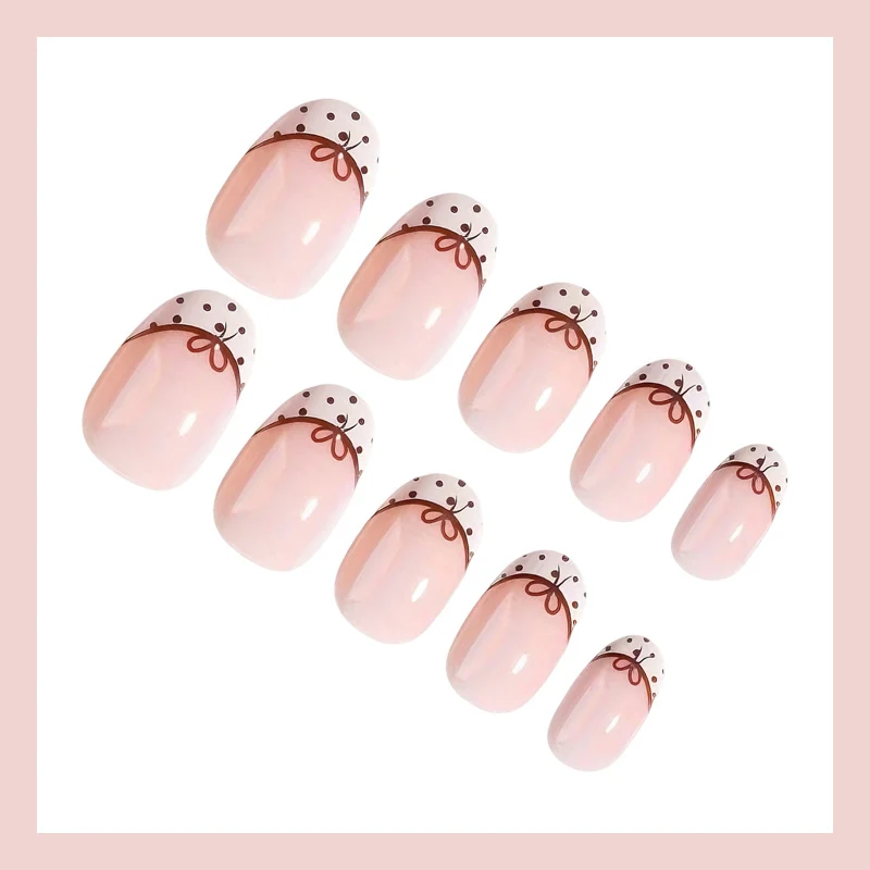 Kunstnagelset mit eleganten Schleifen- und Punktmotiven Brehn