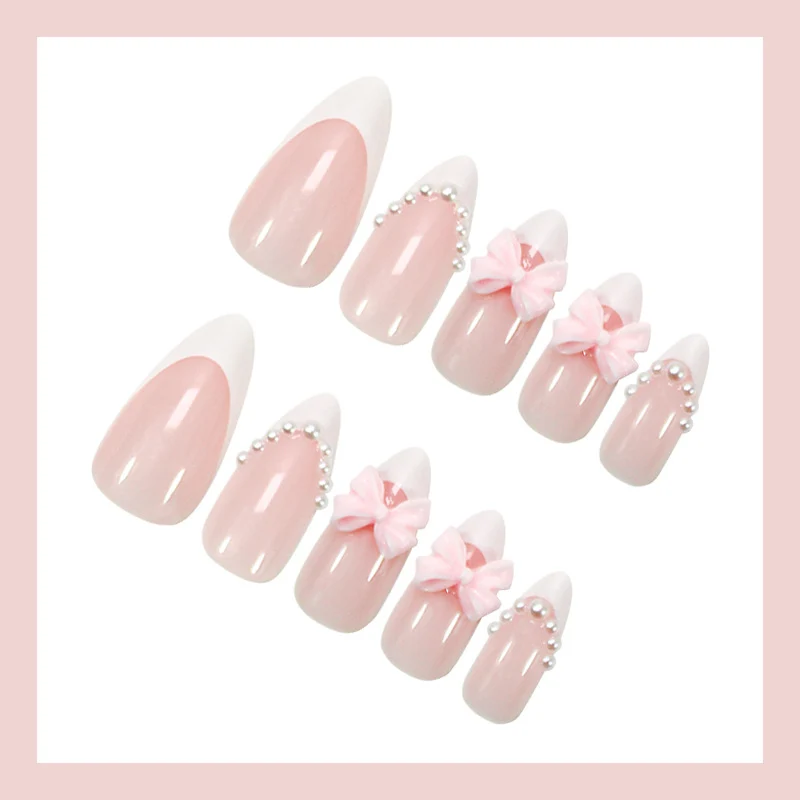 Kunstnagelset mit eleganten Schleifen- und Perlenverzierungen Brehn
