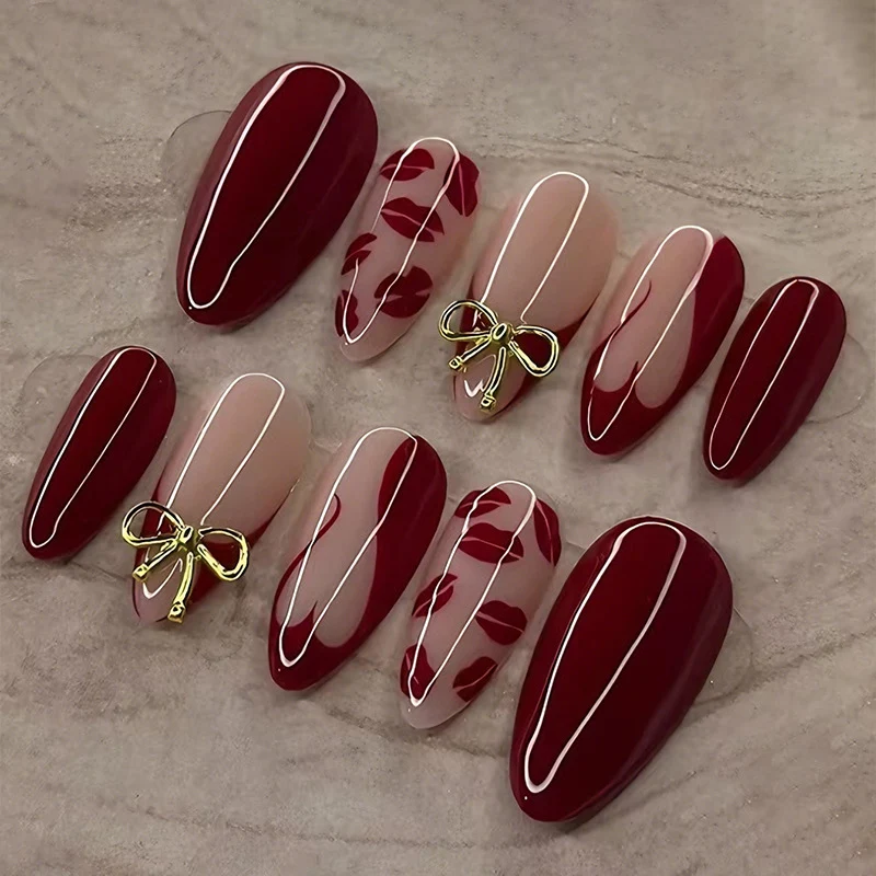 Kunstnagelset mit eleganten Schleifen- und Kussmund-Designs Brehn